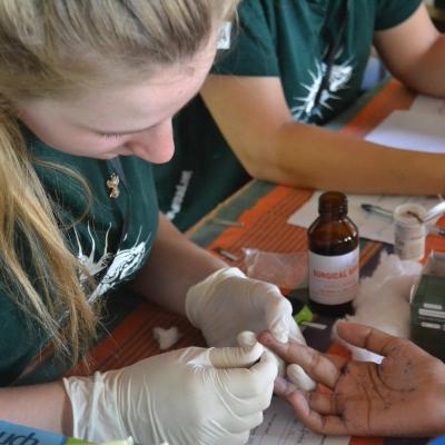 A female intern from Projects Abroad is pictured carrying out blood sugar tests at a screening centre whilst on her public health work experience in Sri Lanka. An intern gaining valuable work experience whilst taking blood sugar tests during her public health internship in Sri Lanka with Projects Abroad.
